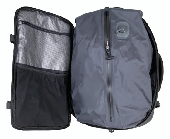 Voyge backpack opened, showing the laptop compartment and the gray vacuum compression bag